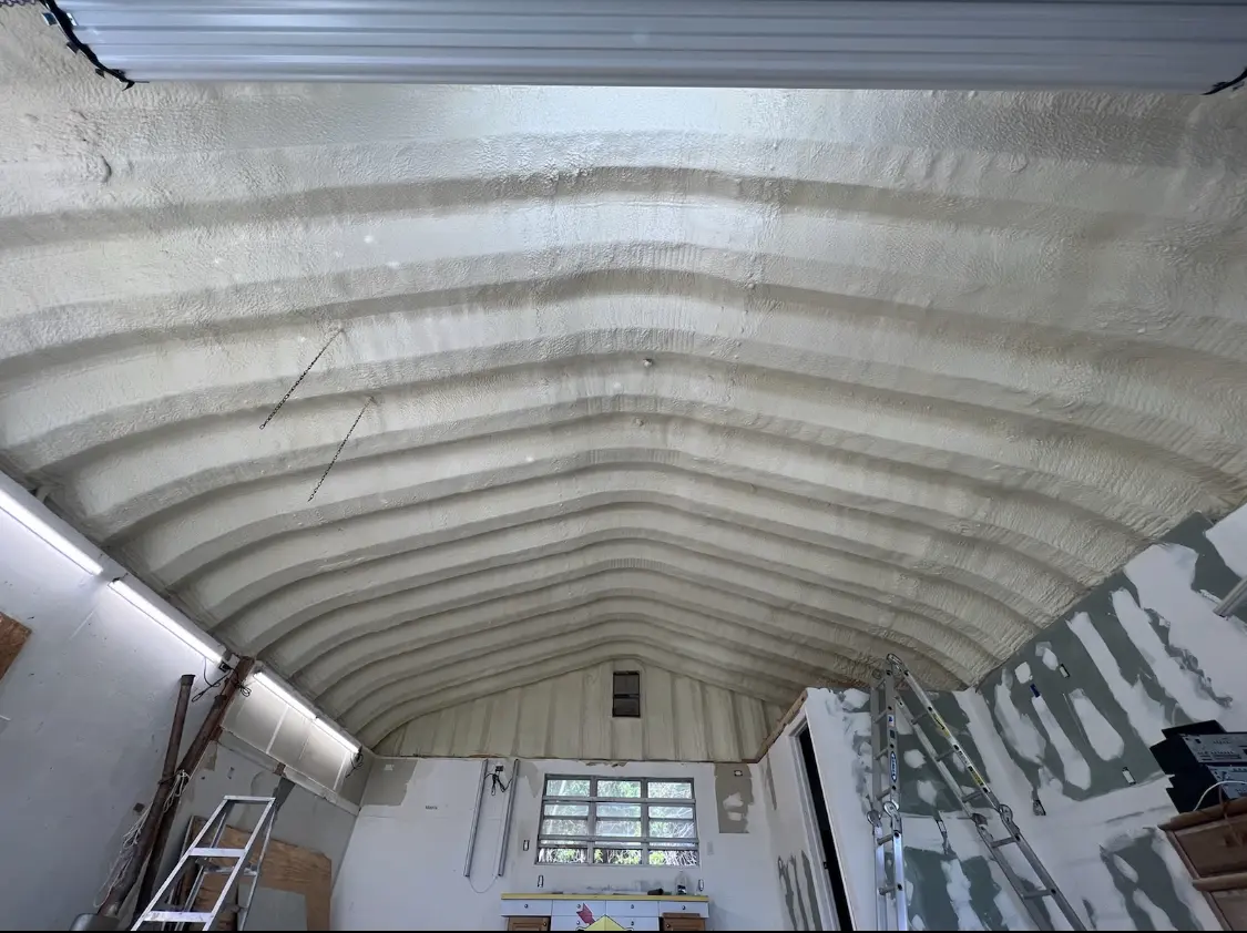 Spray polyurethane foam applied to the underside of a metal roof deck in Charleston
